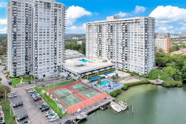 drone / aerial view with a view of city and a water view