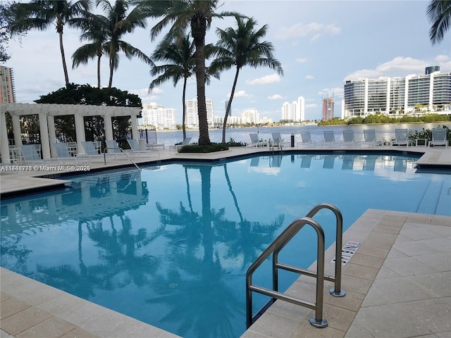 pool featuring a city view and a pergola