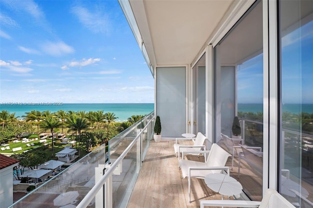 balcony featuring a water view