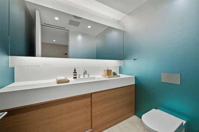 bathroom featuring recessed lighting, visible vents, vanity, and toilet