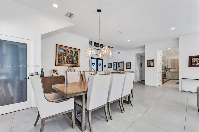 dining space with light tile patterned floors, visible vents, and recessed lighting