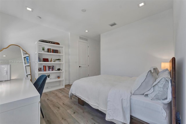 bedroom featuring visible vents, light wood-style flooring, and recessed lighting