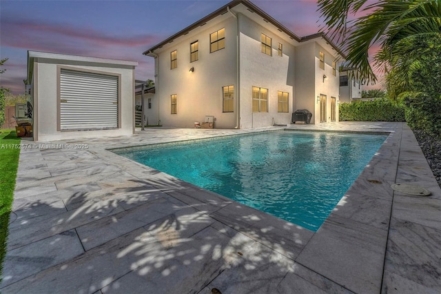 outdoor pool featuring a patio