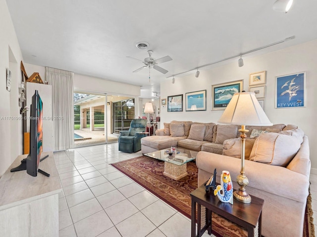 living room with light tile patterned floors, ceiling fan, rail lighting, and visible vents