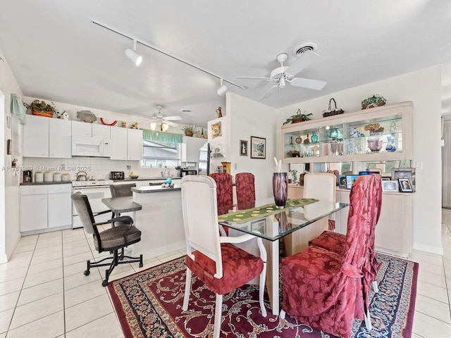 dining area with a ceiling fan, visible vents, and light tile patterned flooring