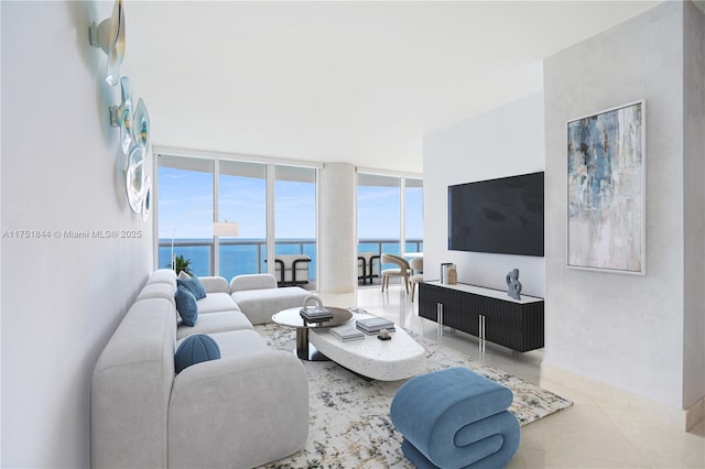 living room featuring expansive windows and tile patterned floors