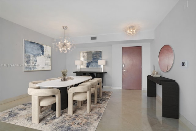 dining room featuring baseboards, visible vents, and a notable chandelier