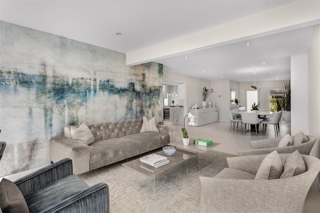 living area featuring recessed lighting and beam ceiling