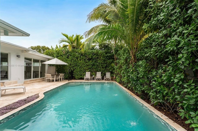 pool with a patio