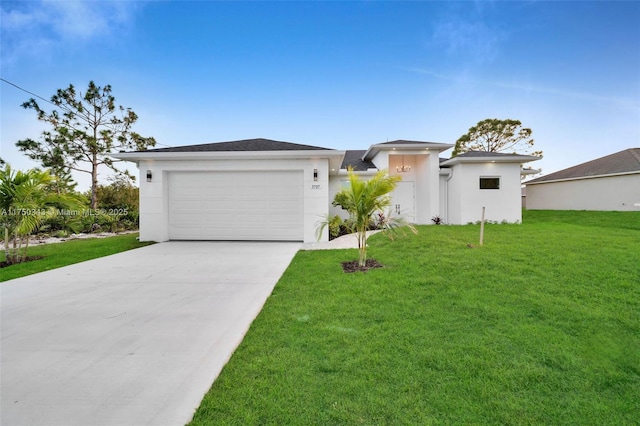 prairie-style home featuring an attached garage, stucco siding, concrete driveway, and a front yard