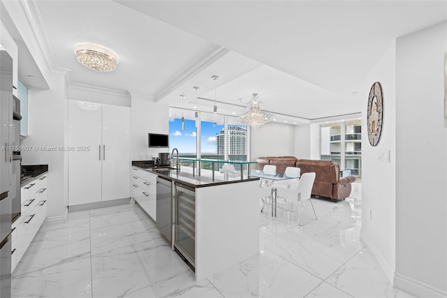 1830 S Ocean Dr Unit 3708, Hallandale Beach, FL 33009 - kitchen featuring modern cabinets, dark countertops, a sink, white cabinetry, and a chandelier