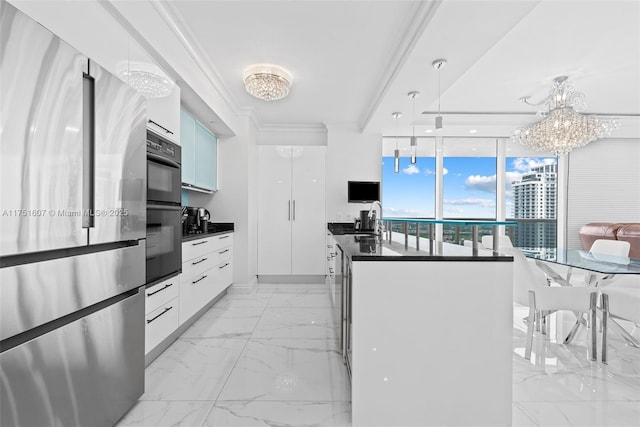 1830 S Ocean Dr Unit 3708, Hallandale Beach, FL 33009 - kitchen featuring freestanding refrigerator, dark countertops, a chandelier, crown molding, and light marble finish flooring
