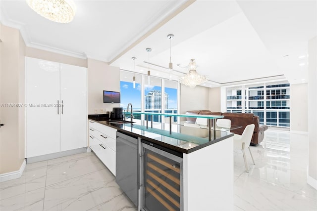 1830 S Ocean Dr Unit 3708, Hallandale Beach, FL 33009 - kitchen with wine cooler, a sink, a chandelier, dark countertops, and ornamental molding