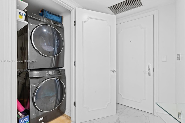 1830 S Ocean Dr Unit 3708, Hallandale Beach, FL 33009 - laundry room with estacked washer and dryer and marble look tile flooring
