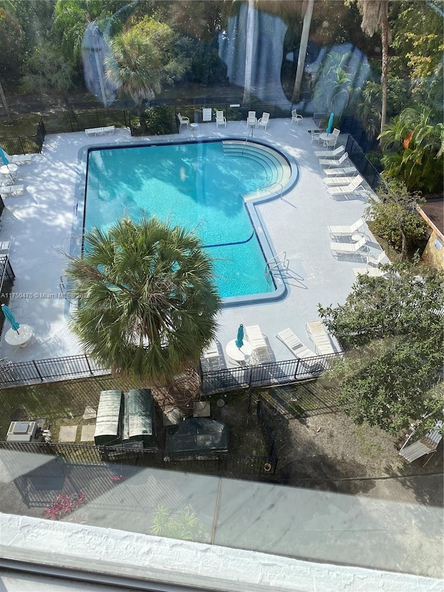 pool featuring a patio area and fence