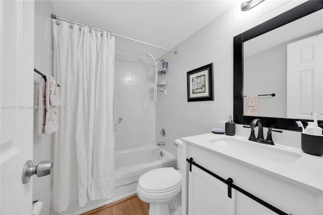 full bath with toilet, wood finished floors, shower / bath combination with curtain, vanity, and tile walls