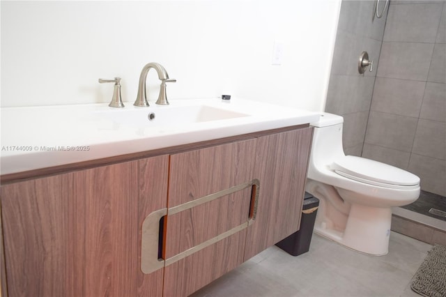 bathroom featuring vanity, toilet, and tile patterned floors