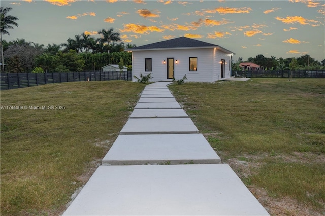 bungalow with fence and a front yard