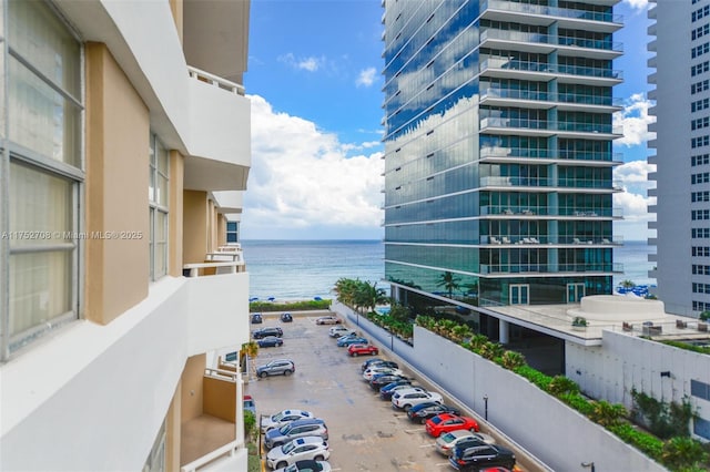 balcony with a water view and a city view