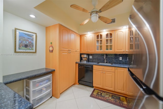 kitchen with dishwasher, glass insert cabinets, freestanding refrigerator, a sink, and light tile patterned flooring