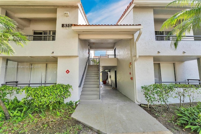 property entrance featuring stucco siding