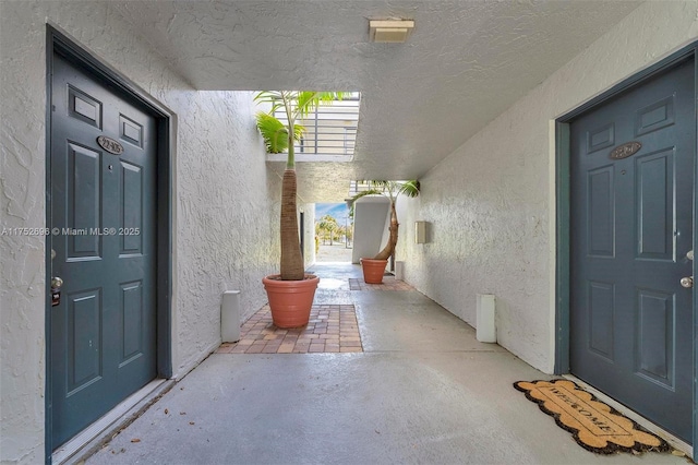 doorway to property with stucco siding