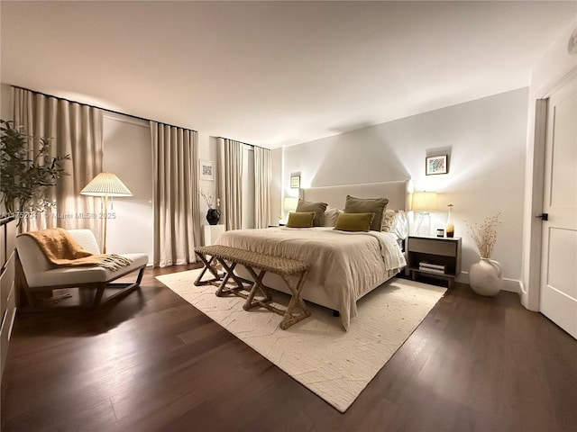 bedroom with wood finished floors