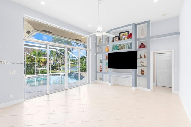 5135 Kensington Cir, Coral Springs, FL 33076 - unfurnished living room with a sunroom, recessed lighting, and built in features