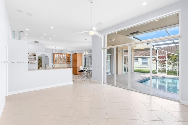 5135 Kensington Cir, Coral Springs, FL 33076 - unfurnished living room with ceiling fan and recessed lighting