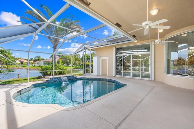 5135 Kensington Cir, Coral Springs, FL 33076 - swimming pool featuring a patio area, a water view, a ceiling fan, and a lanai
