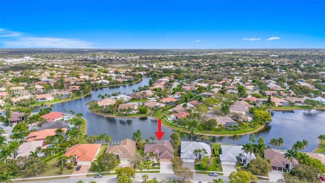 birds eye view of property with a water view and a residential view