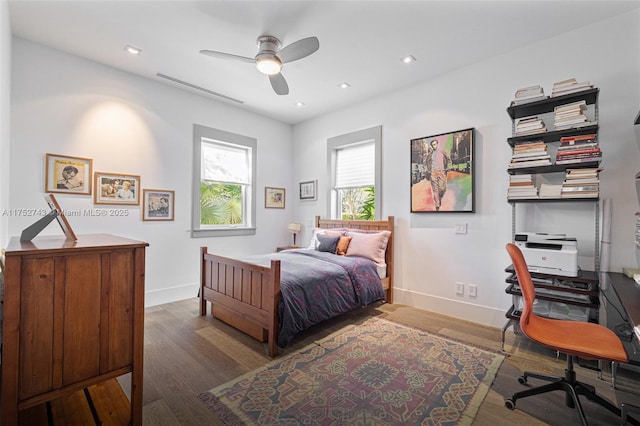 bedroom featuring dark wood-style floors, recessed lighting, ceiling fan, and baseboards