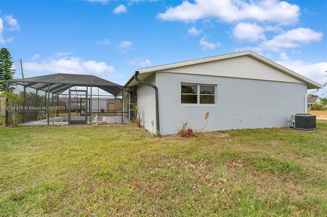 view of home's exterior featuring a lanai, an outdoor pool, a lawn, and central air condition unit