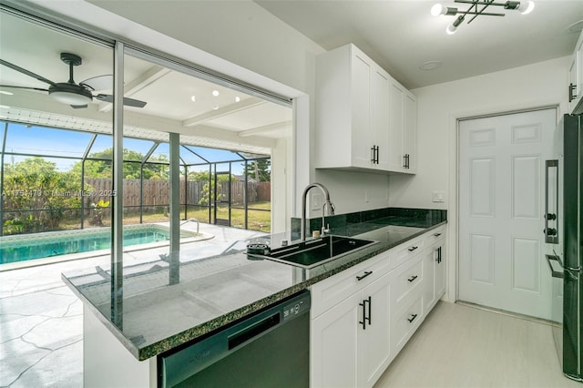 kitchen with a sunroom, black dishwasher, white cabinetry, and a sink