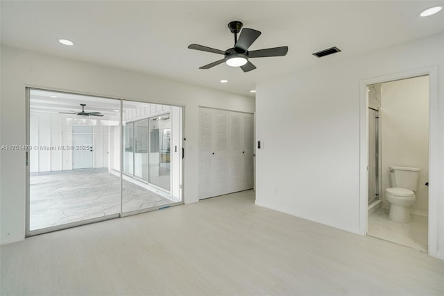 unfurnished bedroom with access to exterior, recessed lighting, visible vents, and light wood-style flooring