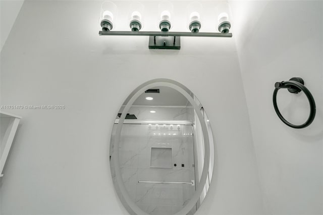 room details with a marble finish shower