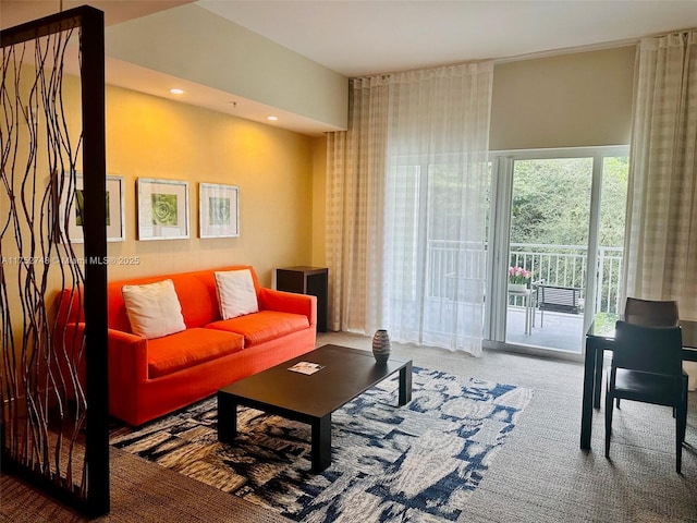 carpeted living area with recessed lighting