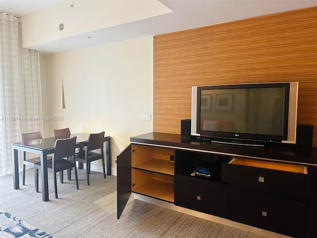 living area featuring light colored carpet