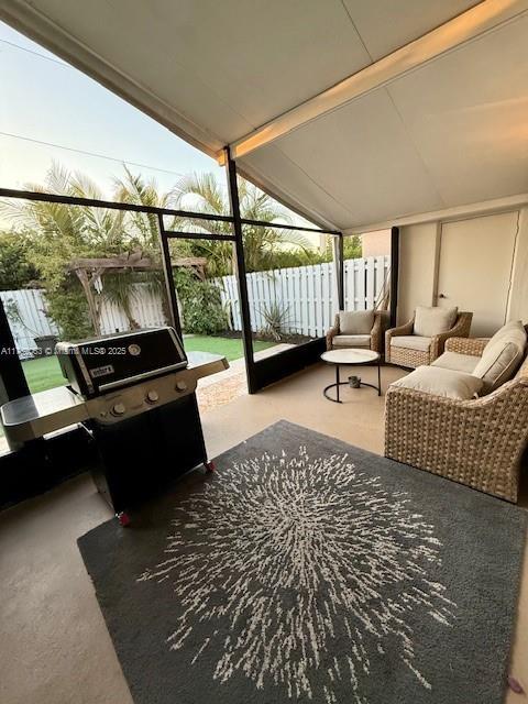 view of patio with fence and outdoor dining space