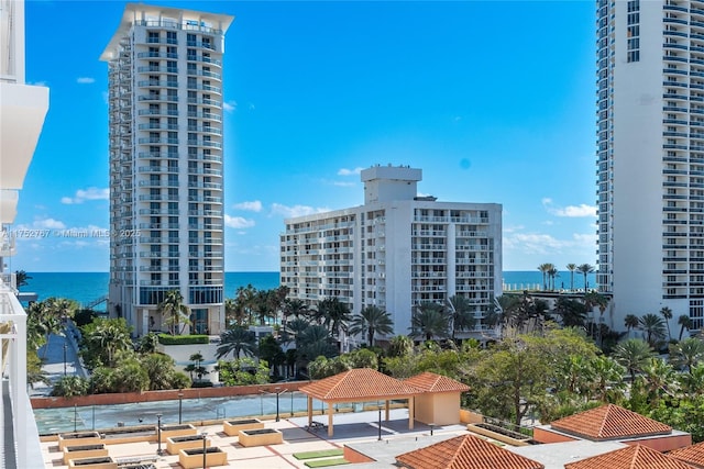 view of property featuring a water view and a city view