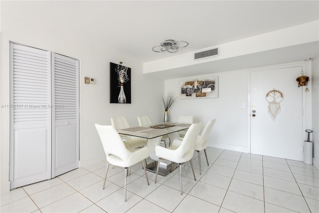 dining area with visible vents, baseboards, and light tile patterned flooring