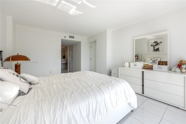 bedroom featuring visible vents and light tile patterned flooring