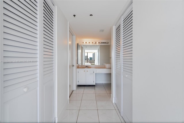 hallway featuring light tile patterned flooring