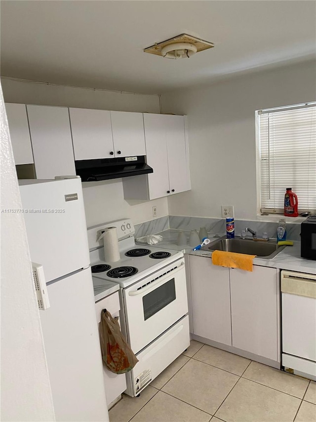 kitchen with light countertops, white cabinetry, a sink, white appliances, and under cabinet range hood