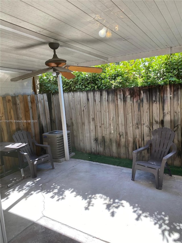 view of patio / terrace featuring central air condition unit, ceiling fan, and fence