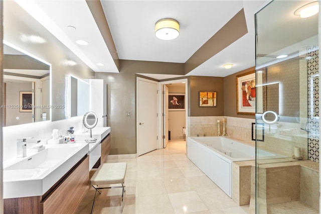 bathroom with a sink, a jetted tub, tile patterned floors, double vanity, and a stall shower