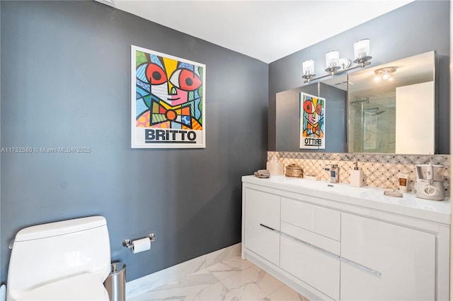 full bath featuring tasteful backsplash, baseboards, toilet, marble finish floor, and vanity