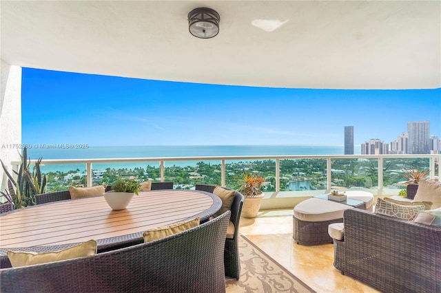 balcony with a view of city and a water view