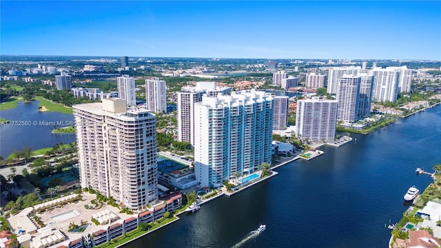 drone / aerial view featuring a water view and a city view