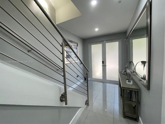 entryway with light tile patterned flooring, recessed lighting, stairway, and french doors